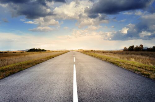 Asphalt Road Under Cloudy Sky