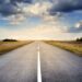 Asphalt Road Under Cloudy Sky