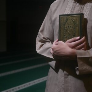 man hugging gold book