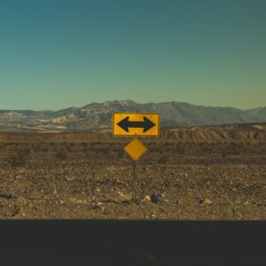 yellow arrow road sign