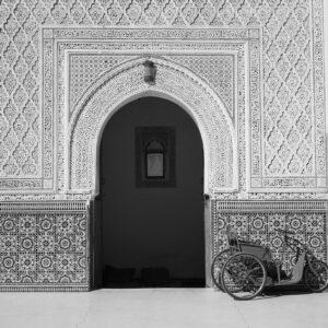 gray trike infront of white concrete house