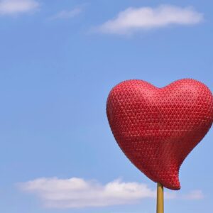 red heart balloon under blue sky during daytime