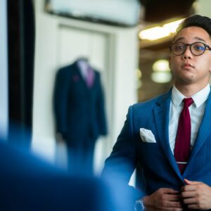 man in black suit wearing eyeglasses