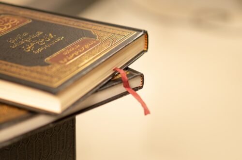 a stack of books sitting on top of a table