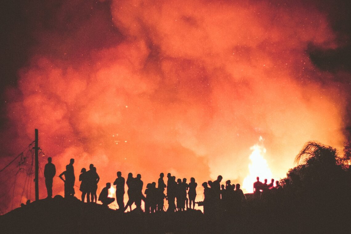 people near bonfire during night