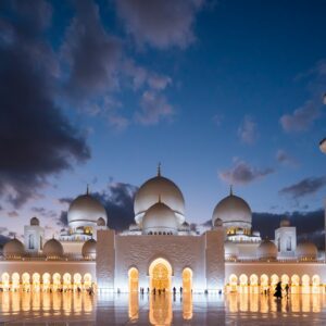 white mosque under cloudy sky