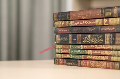 a stack of books sitting on top of a table