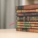 a stack of books sitting on top of a table