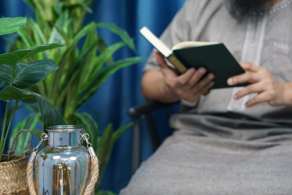 person holding black tablet computer