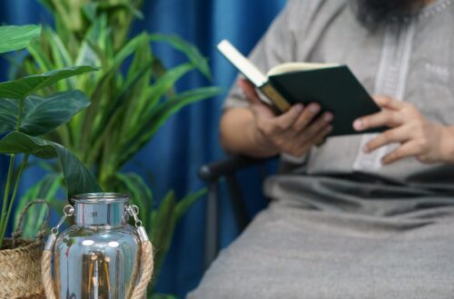 person holding black tablet computer